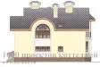 Двухэтажный кирпичный дом с арочными окнами и эркерами