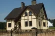 Трёхэтажный дом из кирпича с гаражом в чешском стиле