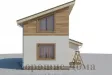 Компактный дом из газобетона с мансардой и односкатной крышей