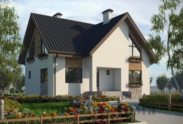 Красивый дом из газобетона с перепендикулярными скатами крыш