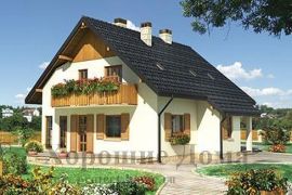 Двухэтажный дом в деревенском стиле с балконом